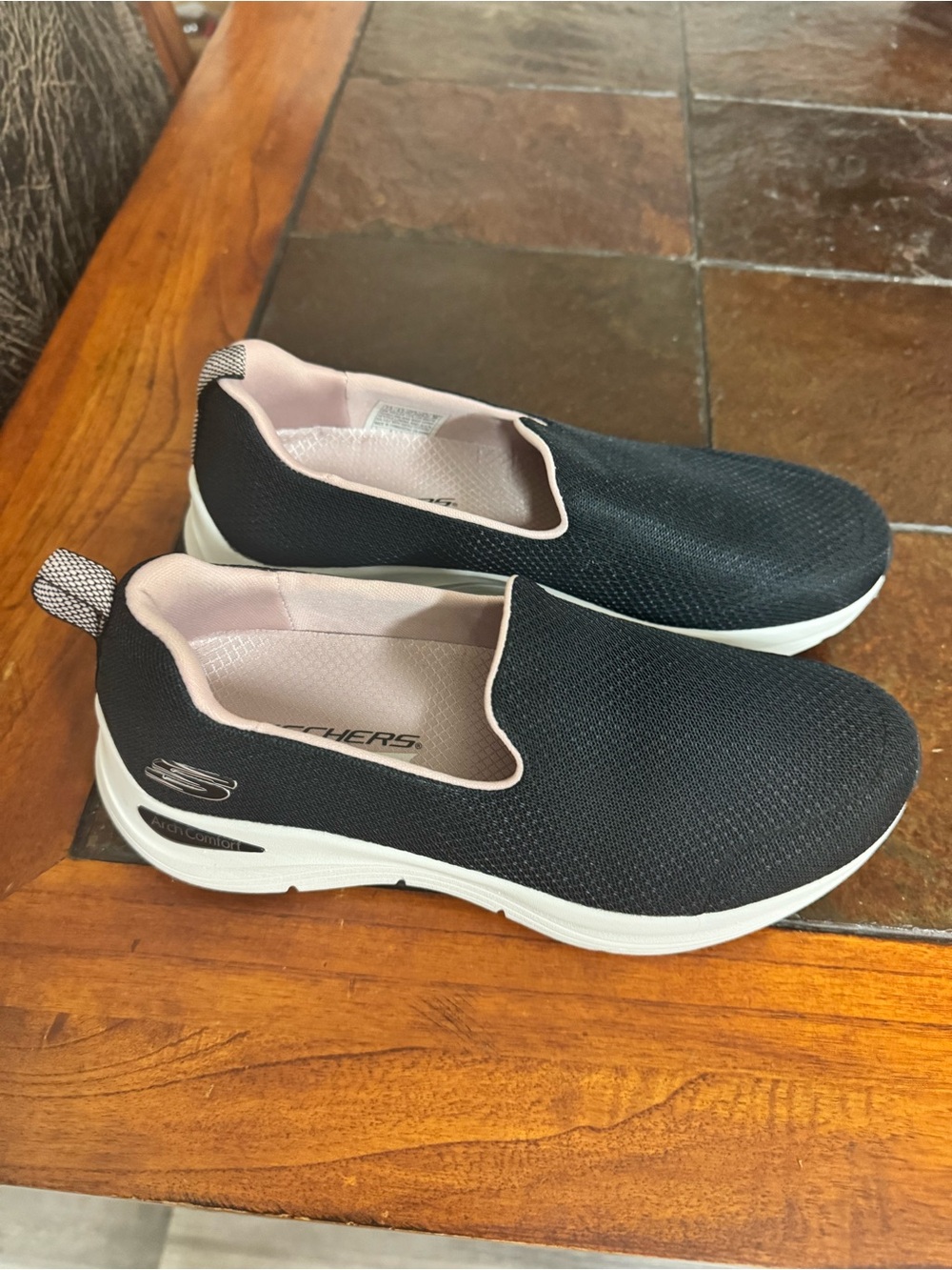 Skechers Black Slip-On Sneakers with Light Pink Lining